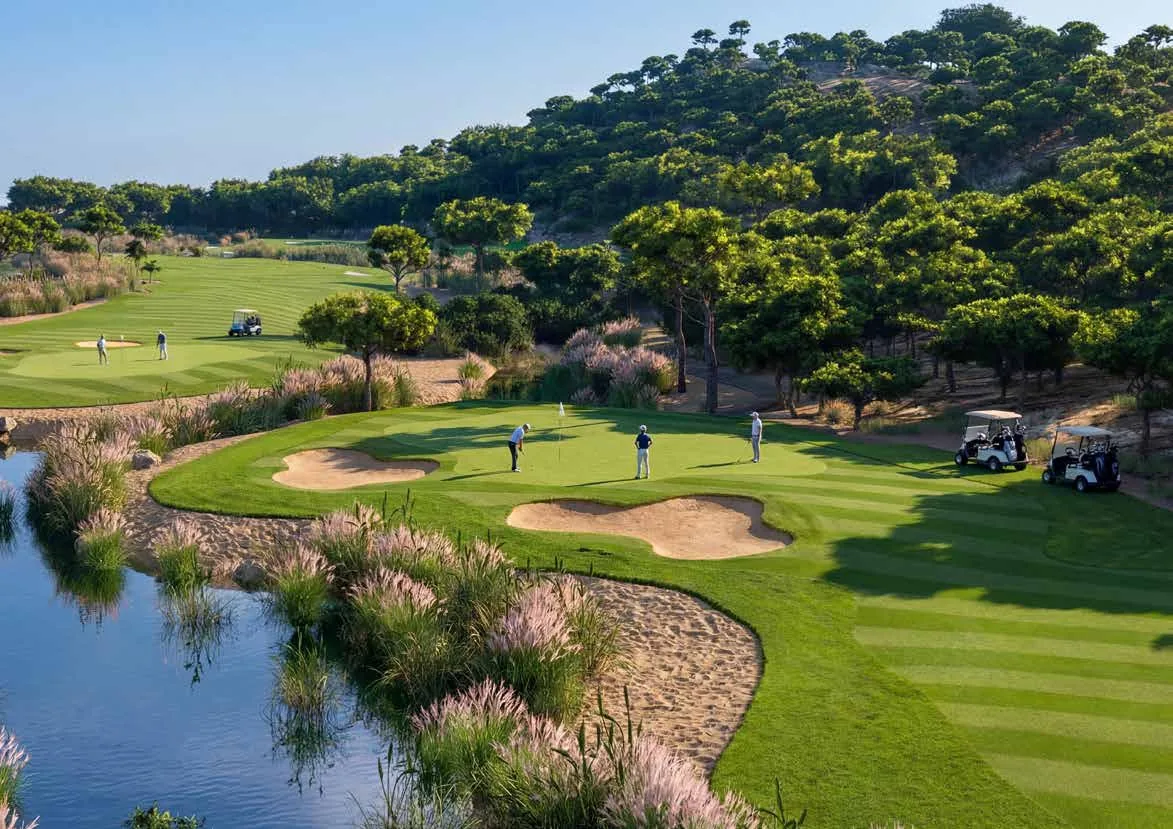 The Dalaman Golf Club green, bunkers and lakeside planting