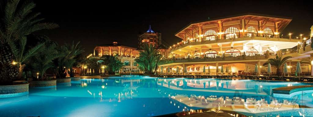 Papillon Zeugma resort pool illuminated after dark